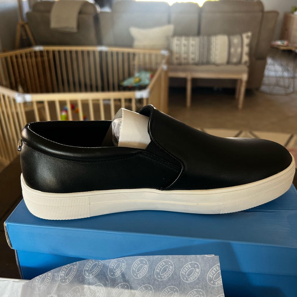Steve Madden women’s slip on black leather shoes. Size 10